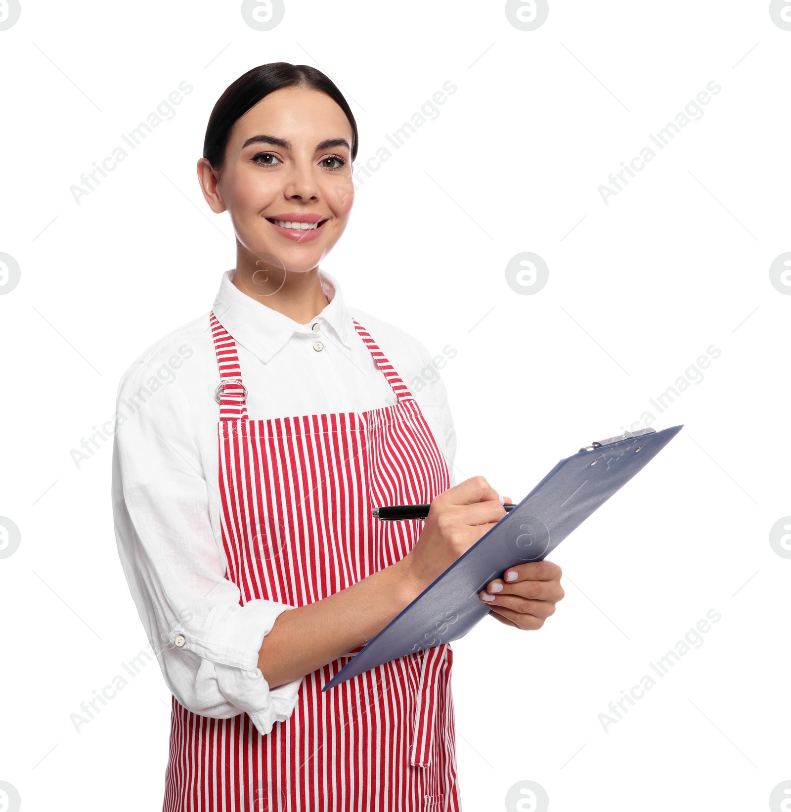 Photo of Young woman in red striped apron with clipboard on white background