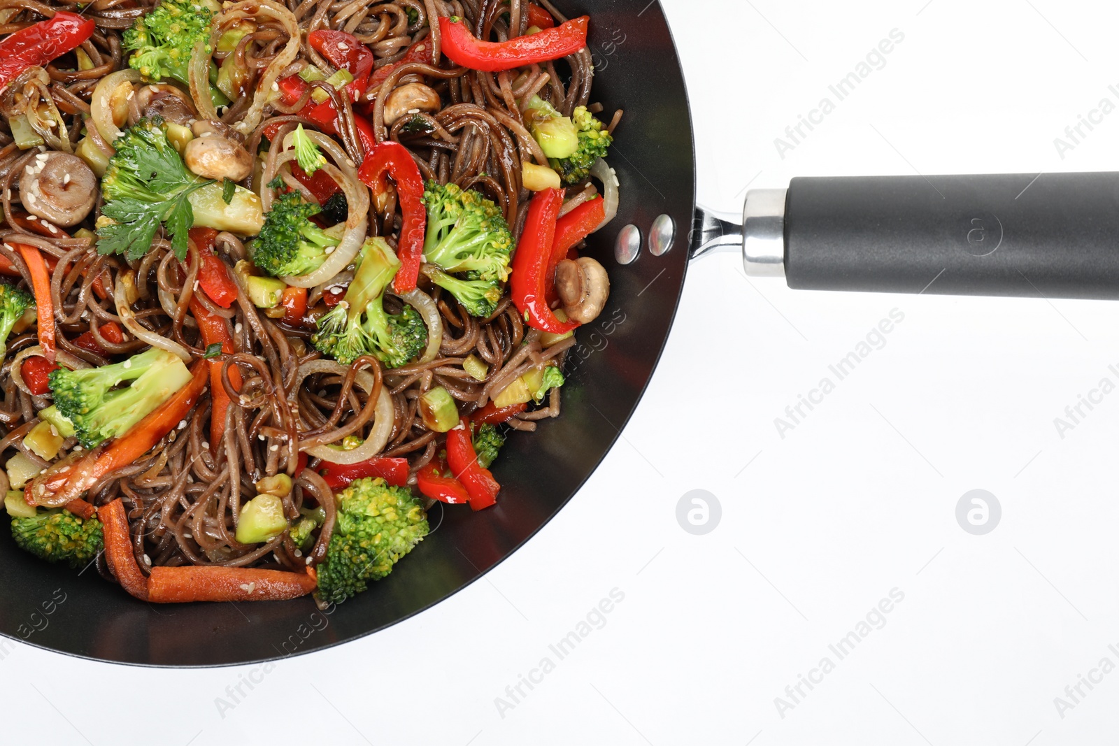 Photo of Stir-fry. Tasty noodles with meat and vegetables in wok on white background, top view