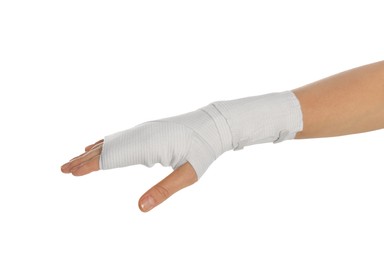 Photo of Woman with hand wrapped in medical bandage on white background, closeup