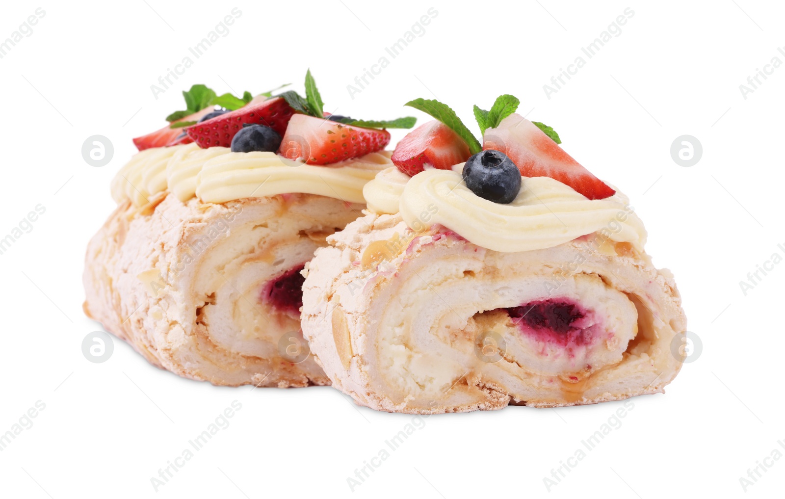 Photo of Tasty meringue roll with jam, berries and mint leaves isolated on white