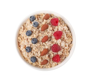 Photo of Tasty boiled oatmeal with berries and almonds in bowl isolated on white, top view