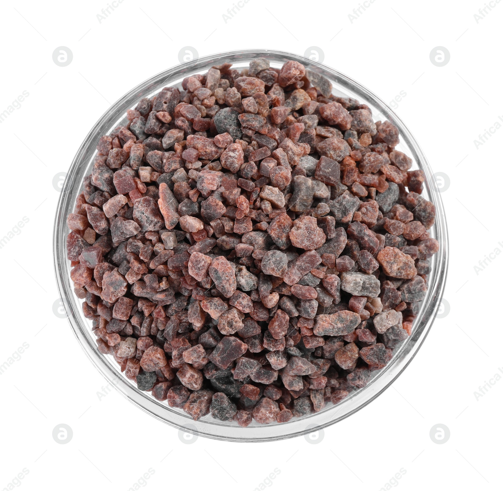 Photo of Black salt in glass bowl isolated on white, top view