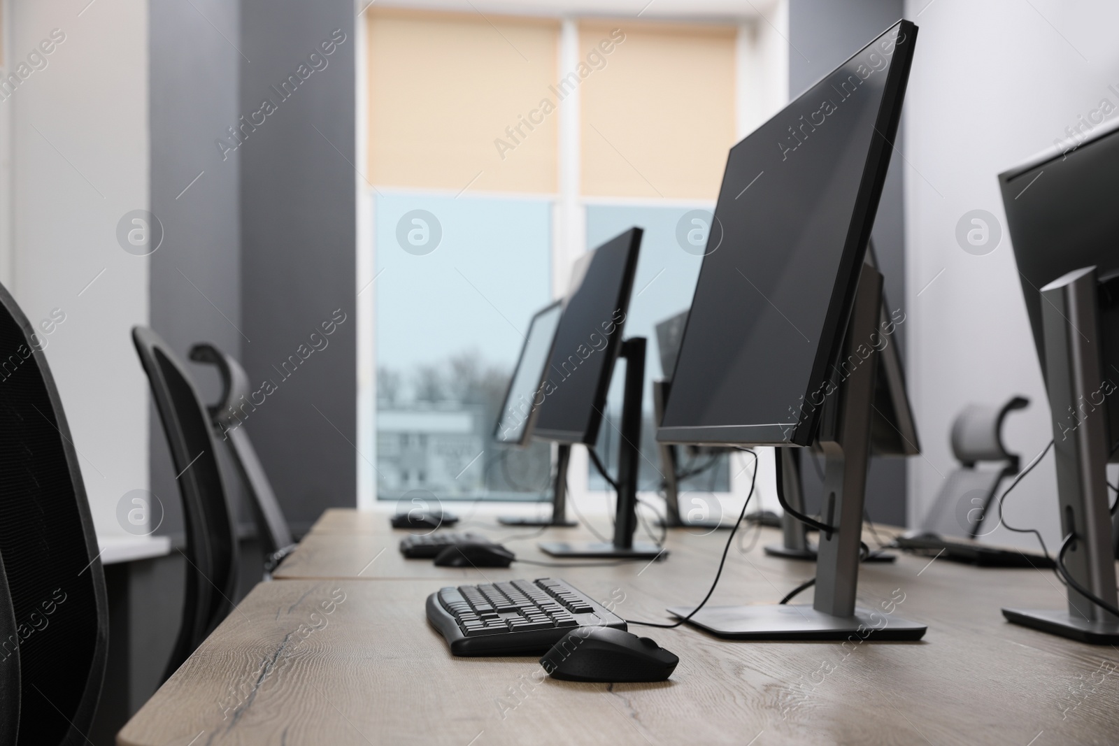 Photo of Many modern computers in open space office