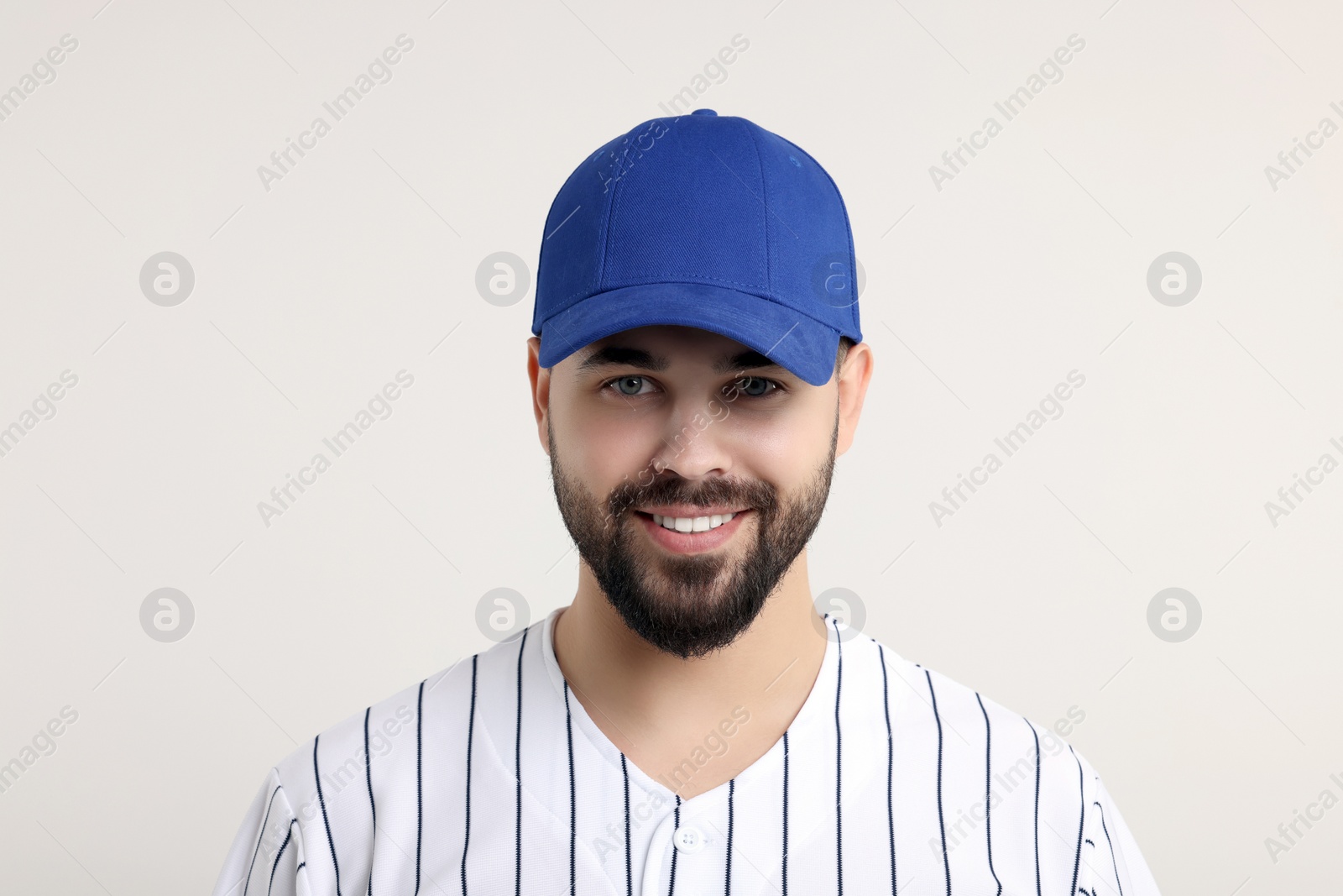 Photo of Man in stylish blue baseball cap on white background