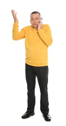 Photo of Full length portrait of emotional mature man talking on phone against white background