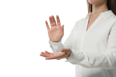 Businesswoman holding something on white background, closeup