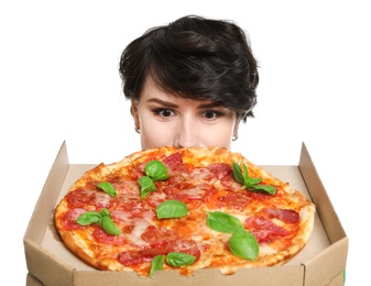 Photo of Attractive young woman with delicious pizza on white background