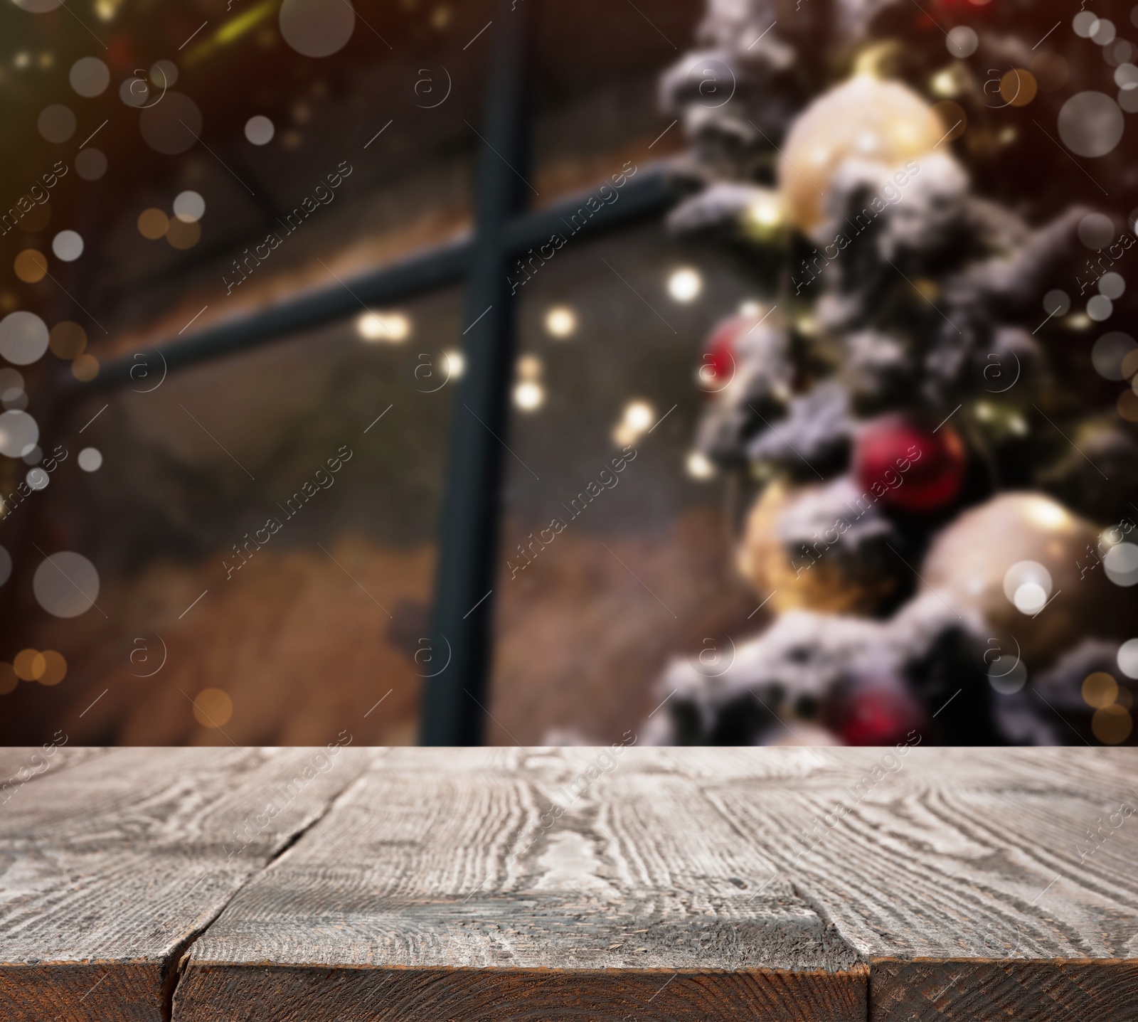 Image of Empty wooden surface and blurred view of Christmas tree