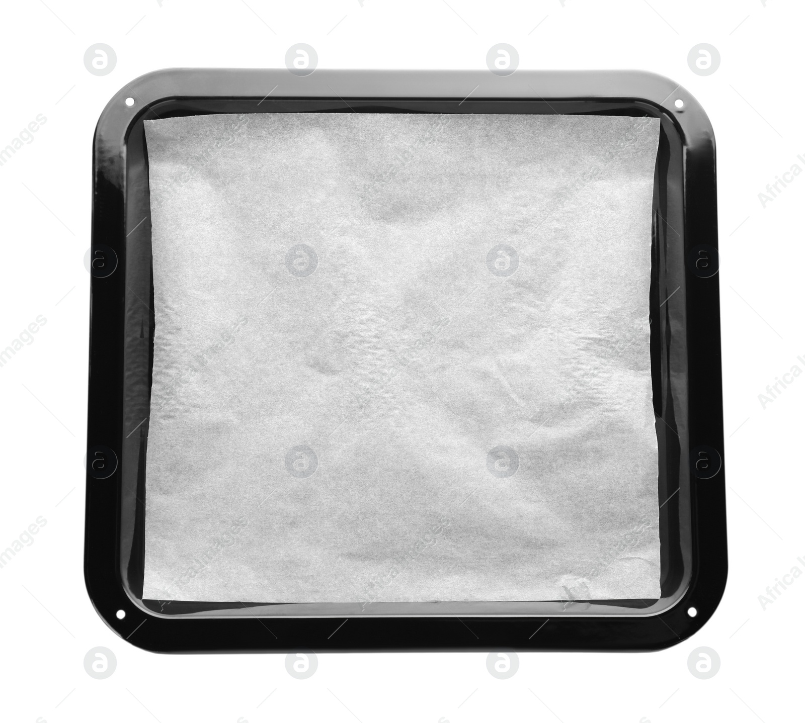 Photo of Baking pan with parchment paper isolated on white, top view