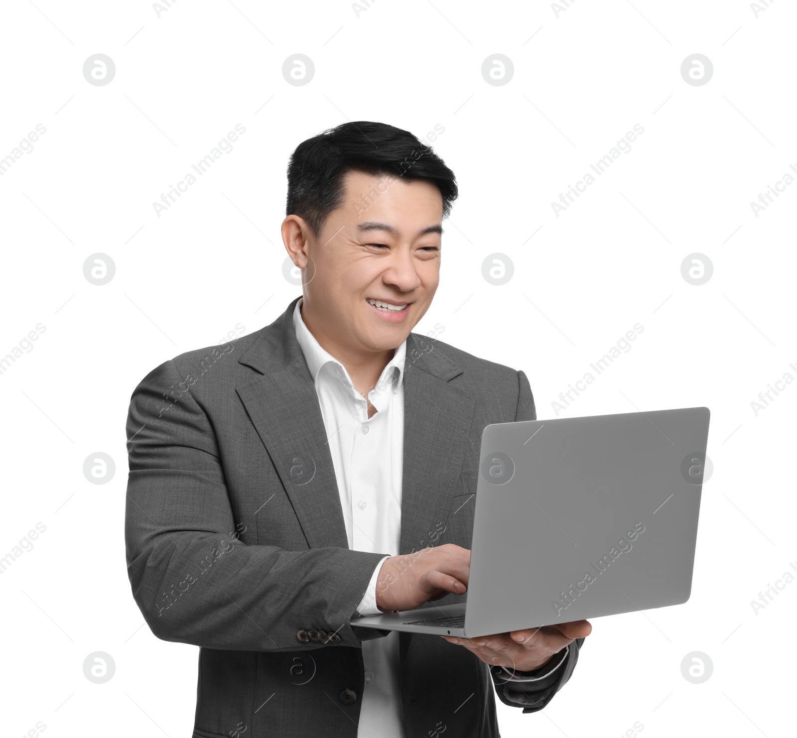 Photo of Businessman in suit working on laptop against white background