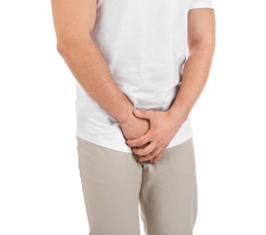 Photo of Young man with urological problems suffering from pain on white background
