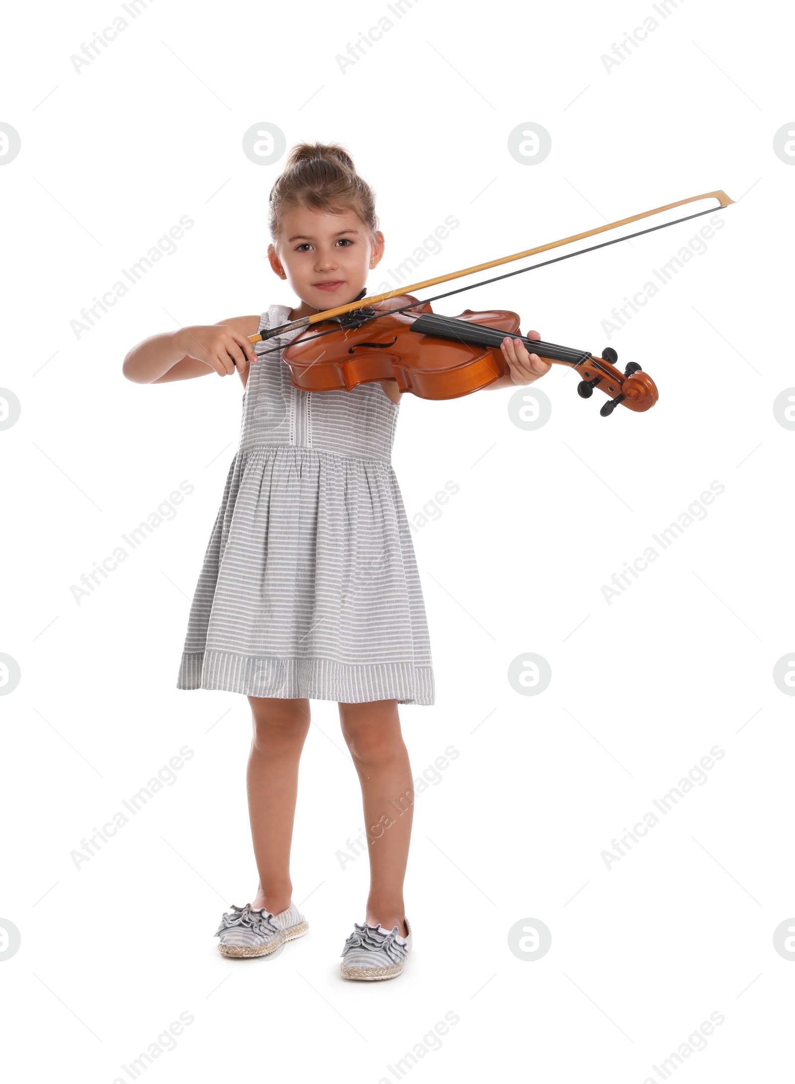 Photo of Little girl playing violin on white background