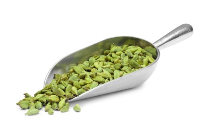 Photo of Metal scoop with dry cardamom seeds on white background