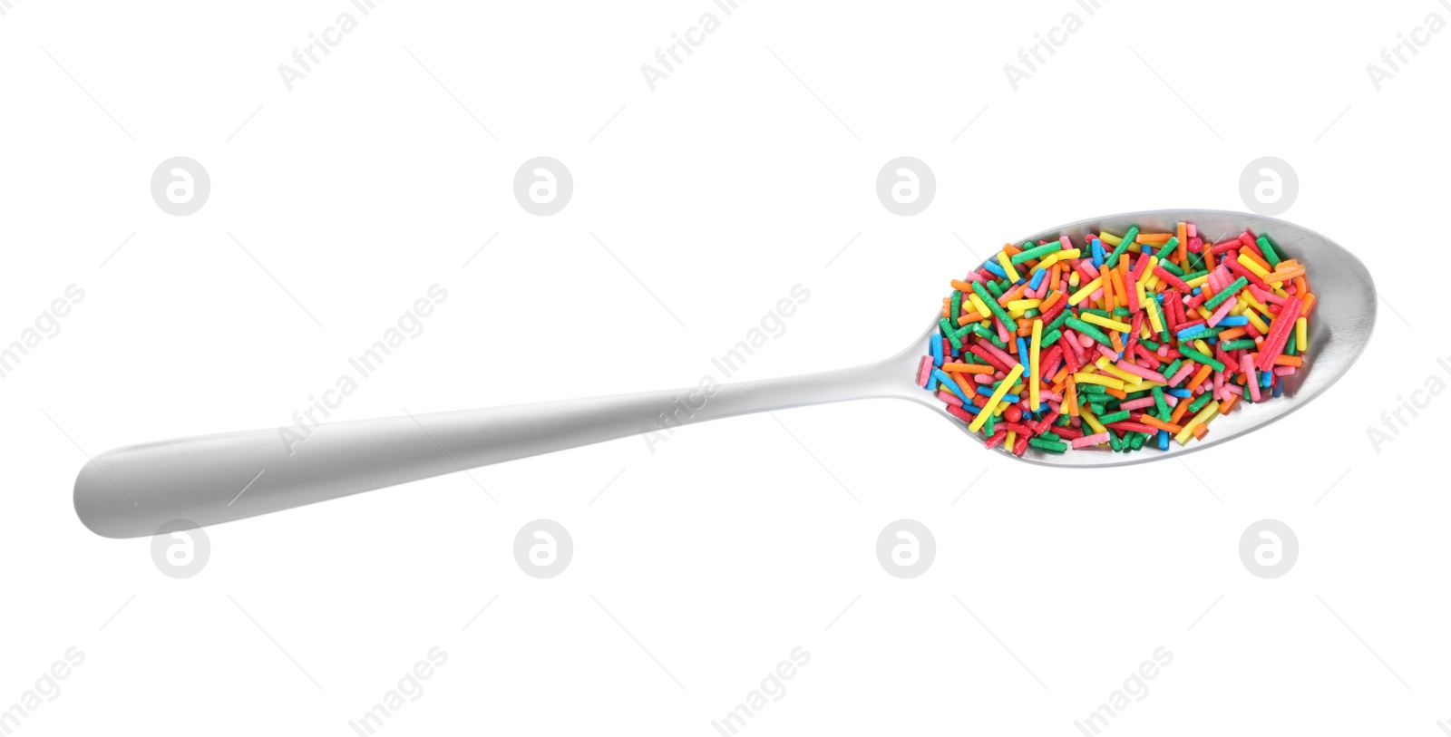 Photo of Colorful sprinkles in spoon on white background, top view. Confectionery decor