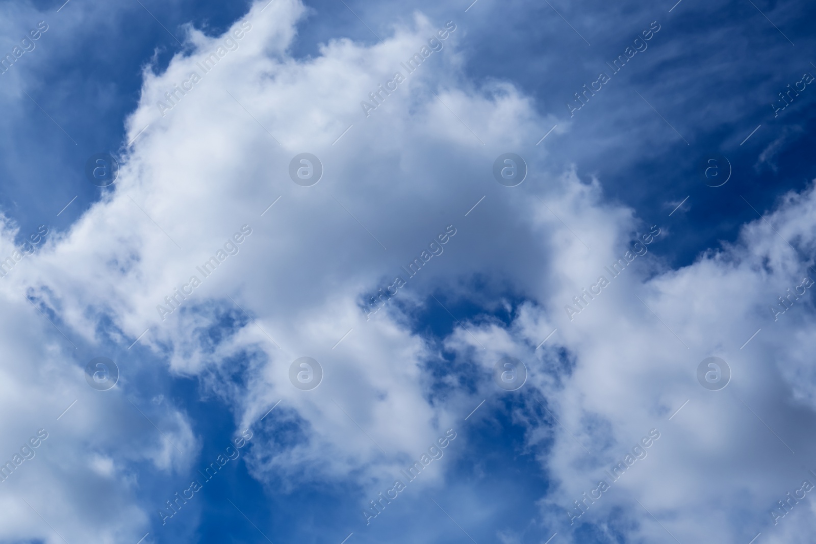 Photo of Picturesque blue sky with white clouds on sunny day