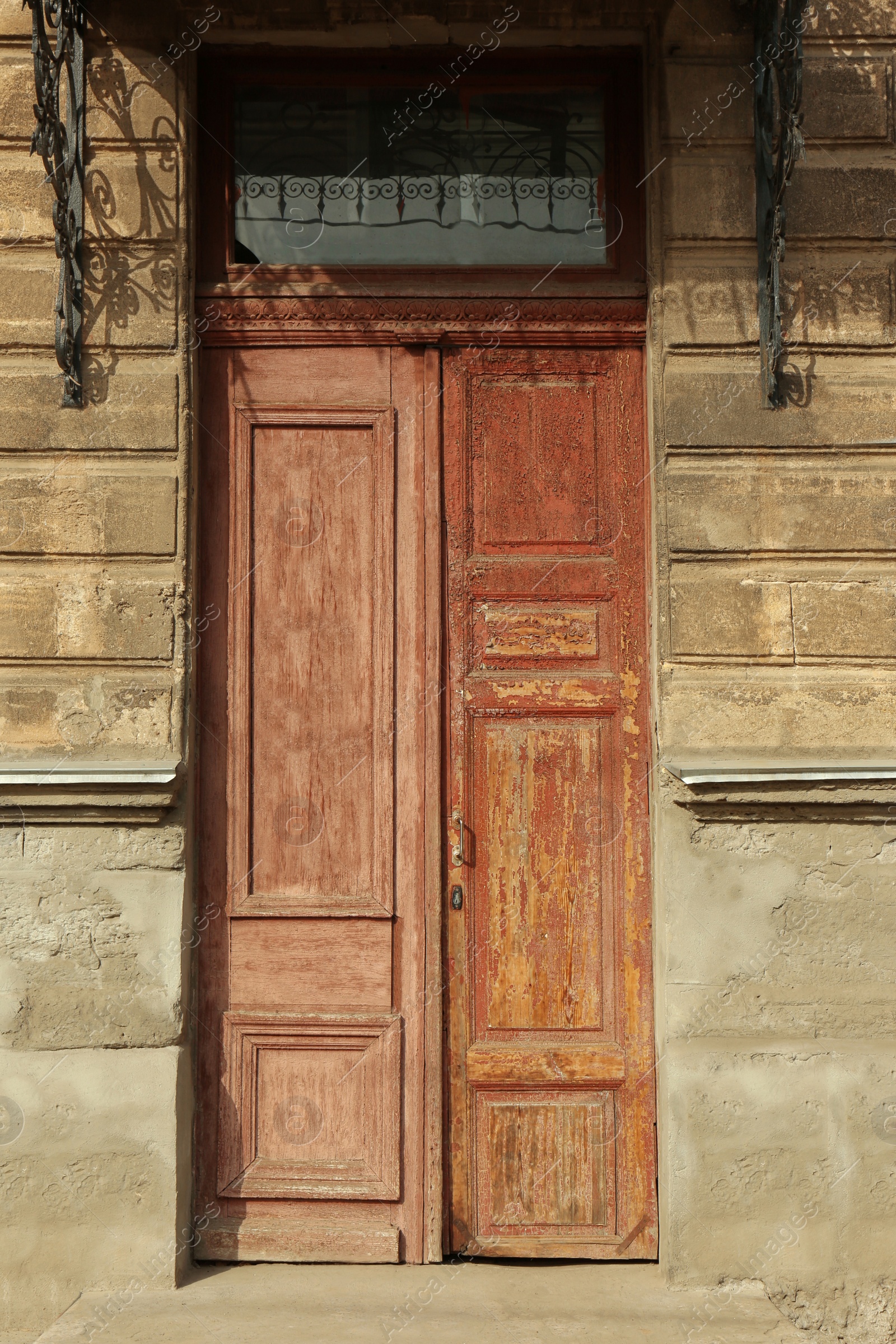 Photo of Closed vintage wooden door in old building