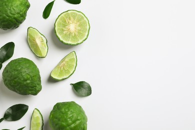 Photo of Flat lay composition with ripe bergamot fruits on white background. Space for text