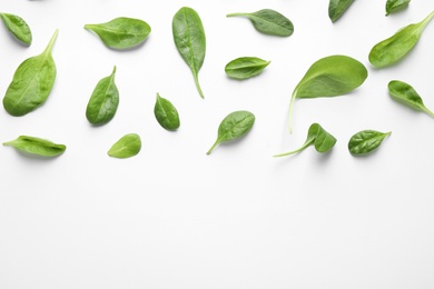 Photo of Fresh green healthy spinach leaves on white background, top view