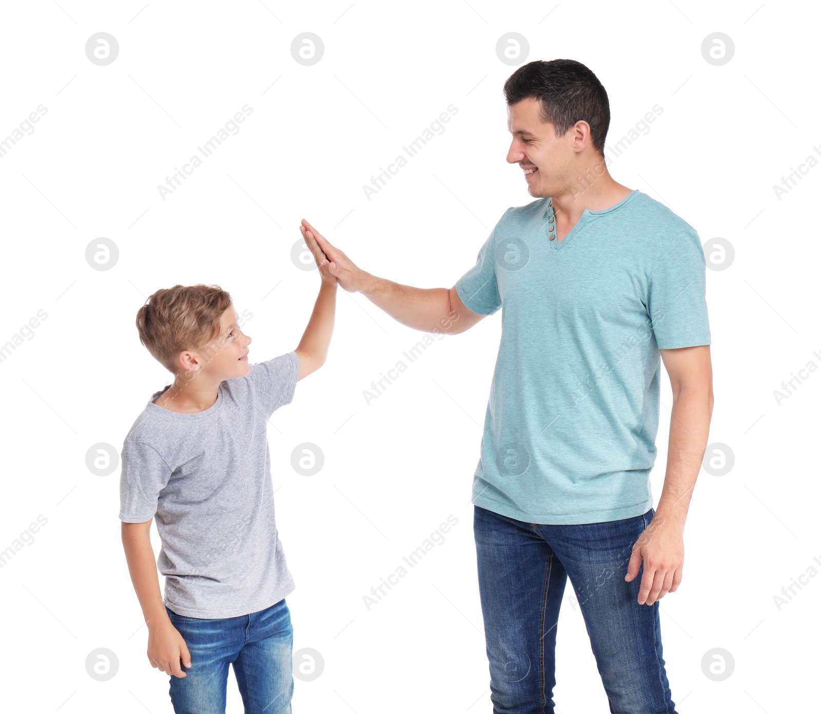 Photo of Father giving high five to his child on white background. Happy family