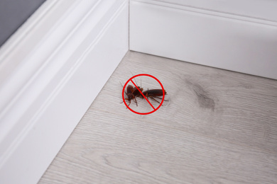 Image of Cockroaches with prohibition sign indoors. Pest control