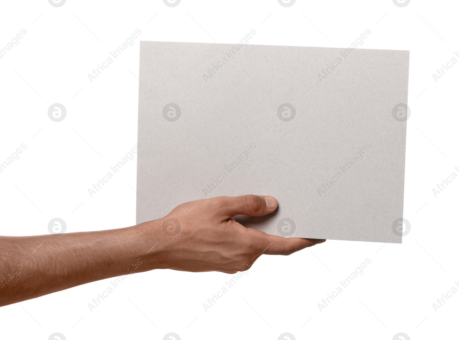 Photo of Man holding sheet of paper on white background, closeup. Mockup for design