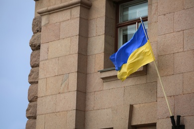 Photo of National flag of Ukraine on building facade
