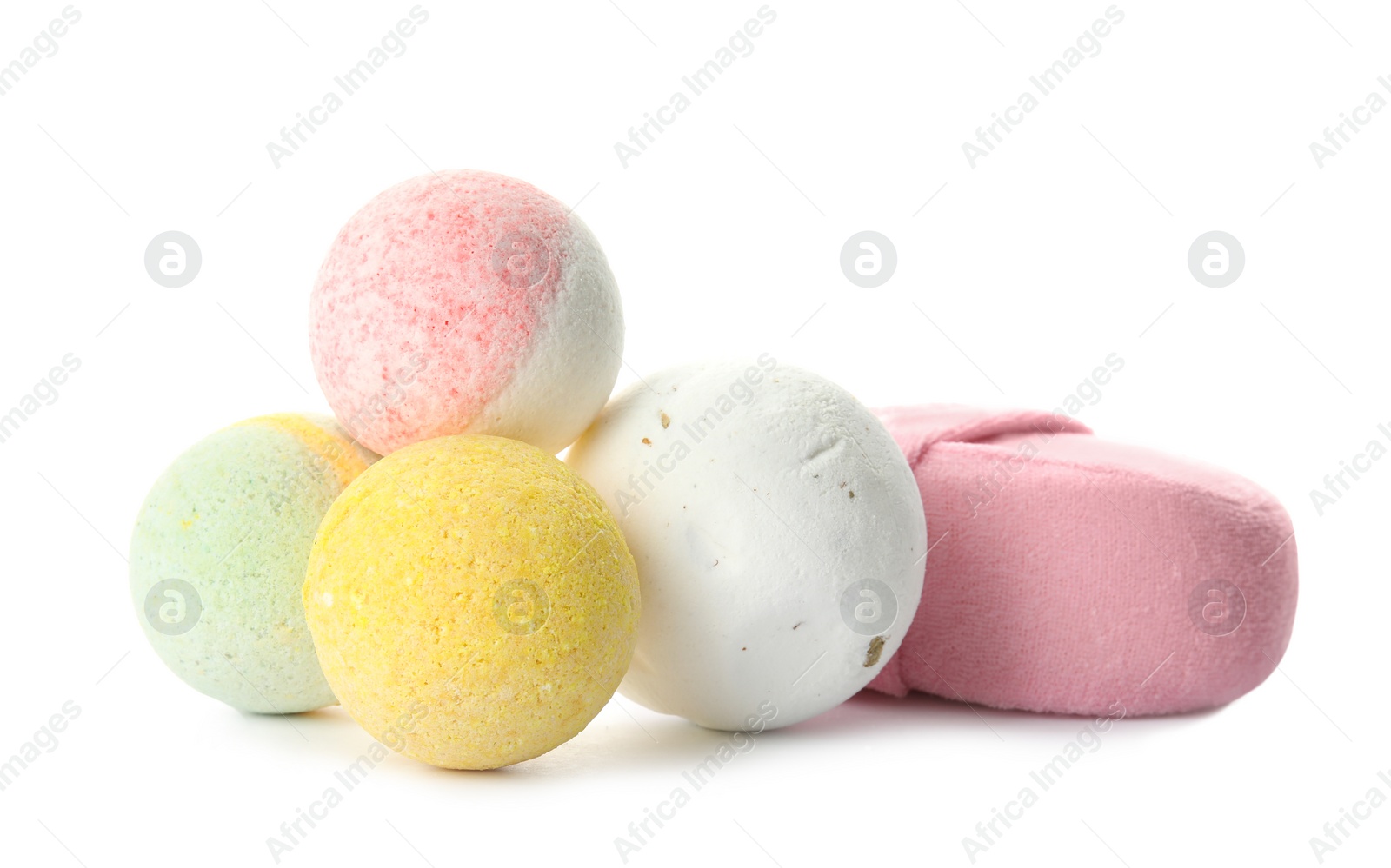 Photo of Bath bombs and sponge on white background