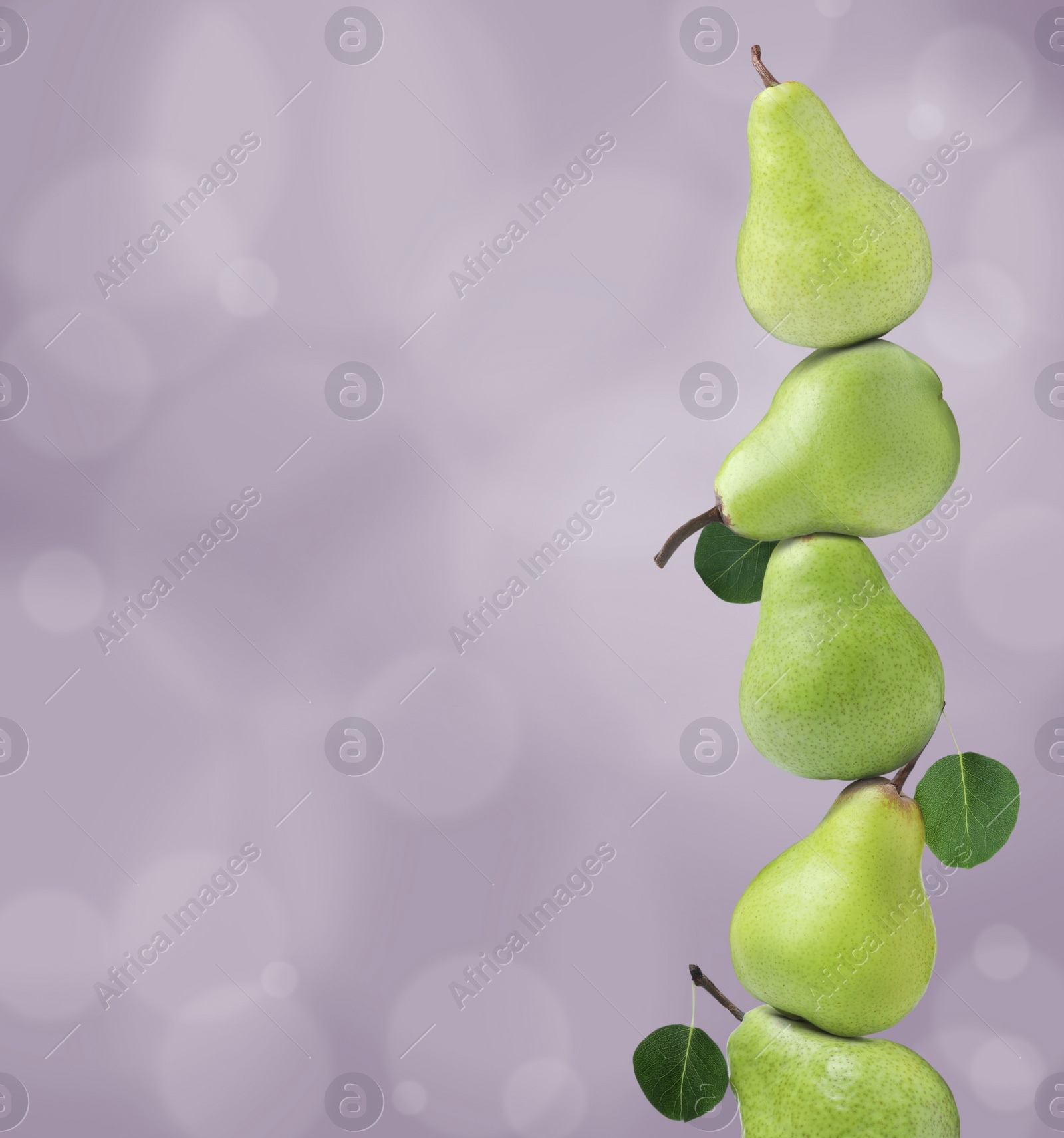 Image of Whole fresh ripe pears on pale violet background, space for text