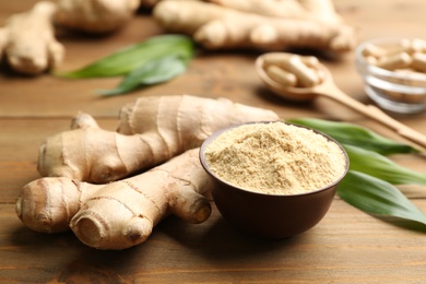 Dry and fresh ginger on wooden table