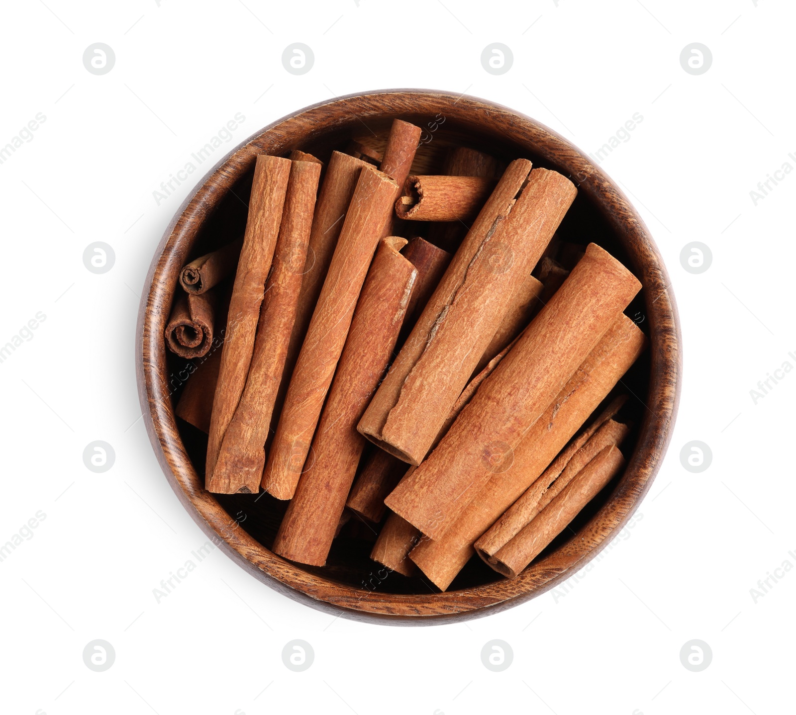 Photo of Cinnamon sticks in bowl isolated on white, top view