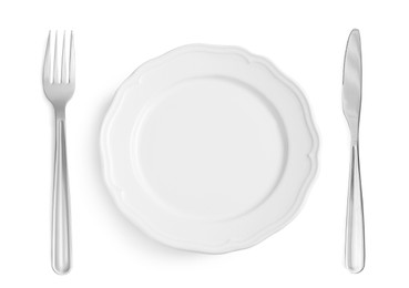 Empty plate with fork and knife on white background, top view