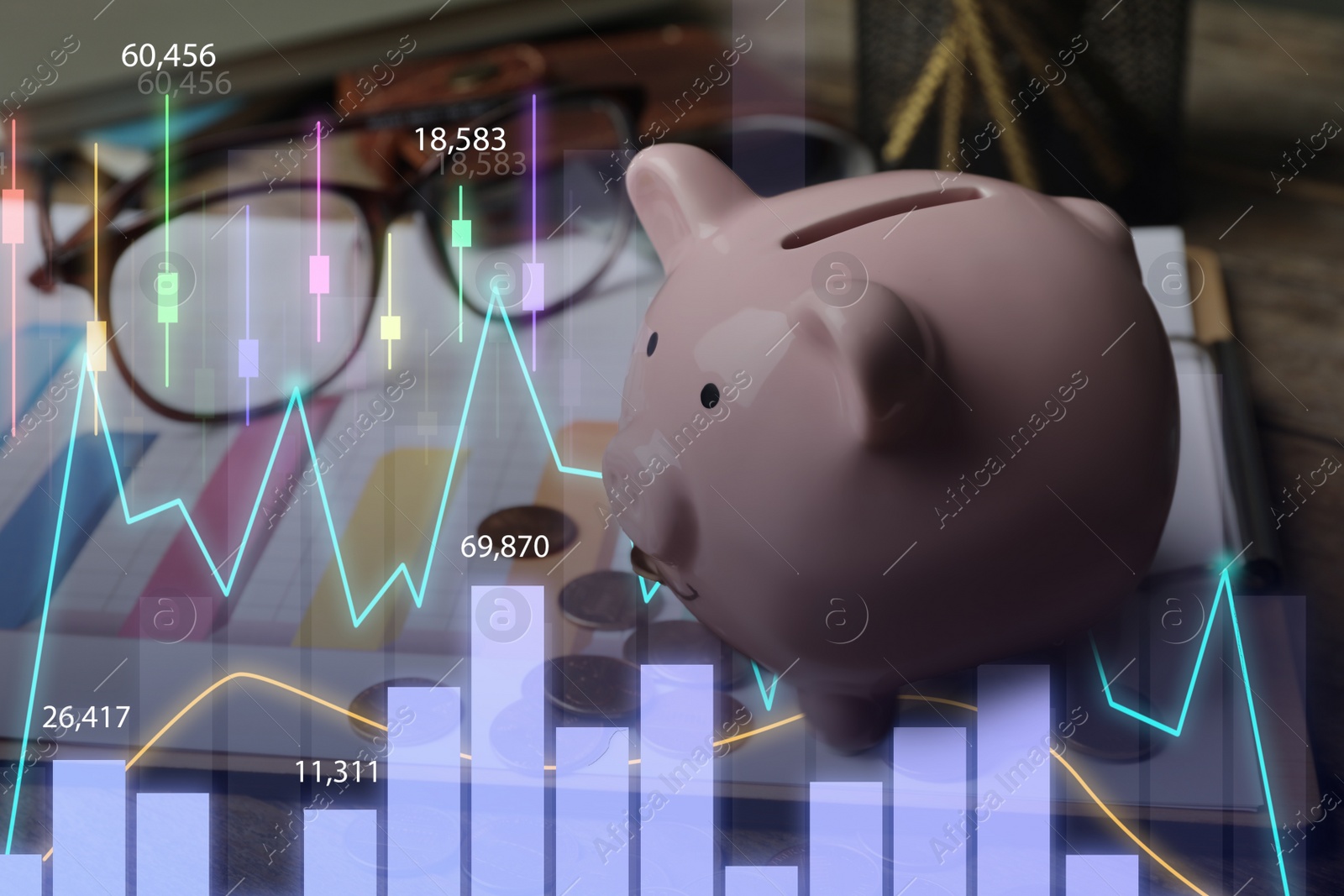 Image of Piggy bank and money on wooden table. Illustration of financial graphs