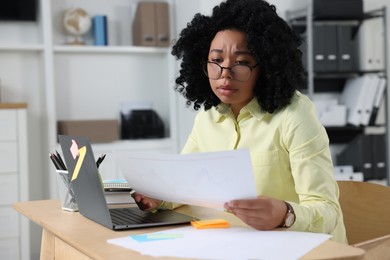 Photo of Deadline concept. Stressed woman looking at document in office