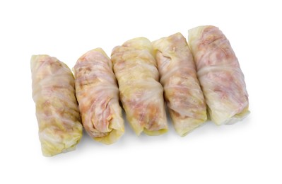 Photo of Uncooked stuffed cabbage rolls isolated on white, top view