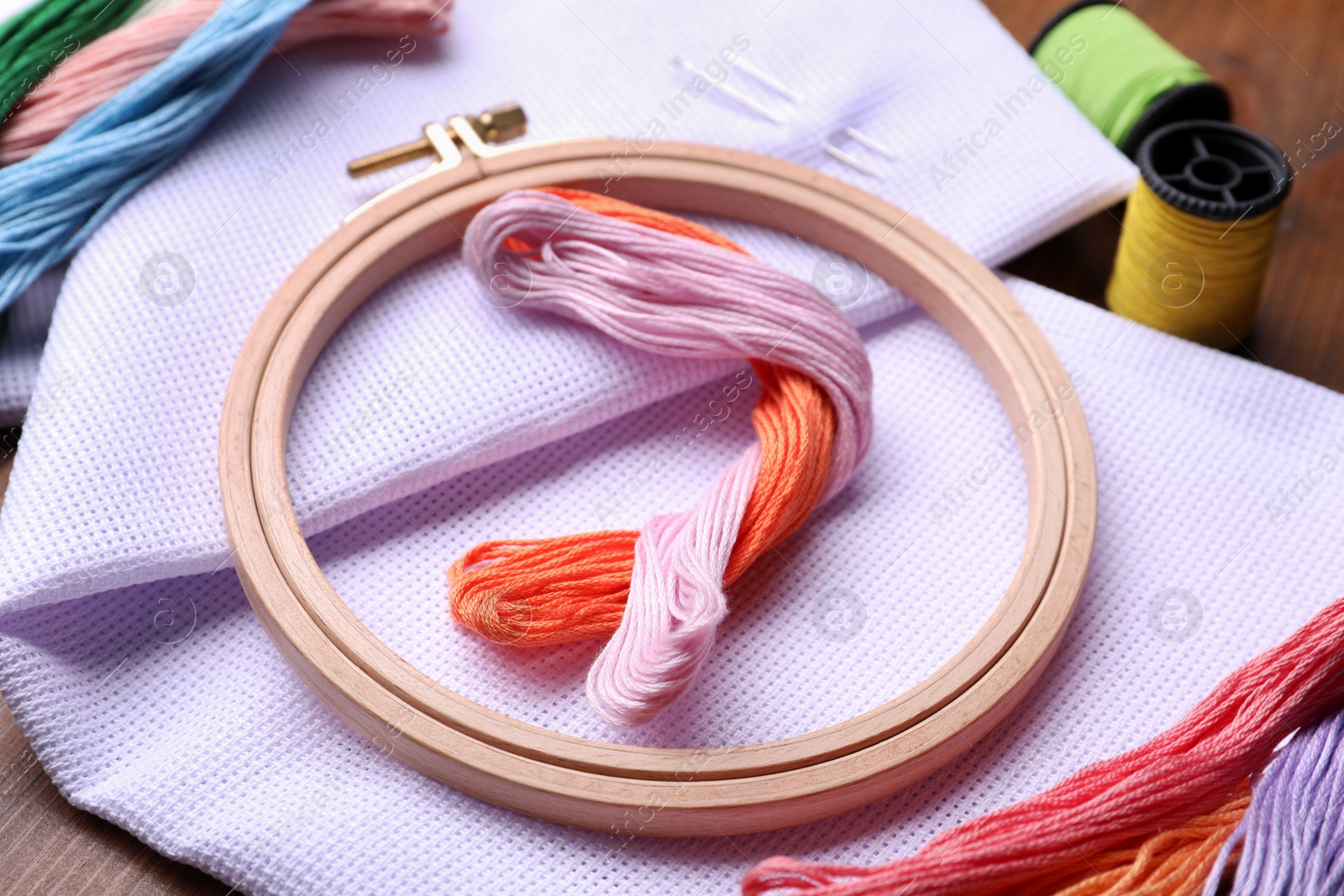 Photo of Set of embroidery equipment on wooden table