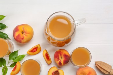Photo of Delicious peach juice, fresh fruits and leaves on white wooden table, flat lay
