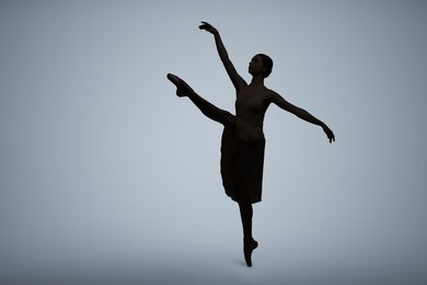 Beautiful ballerina dancing on light grey background, space for text. Dark silhouette of dancer