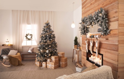 Photo of Beautiful Christmas interior of living room with decorated tree