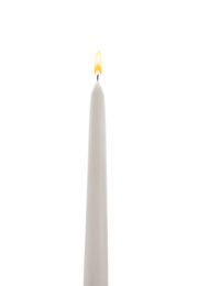 Photo of New wax taper candle isolated on white