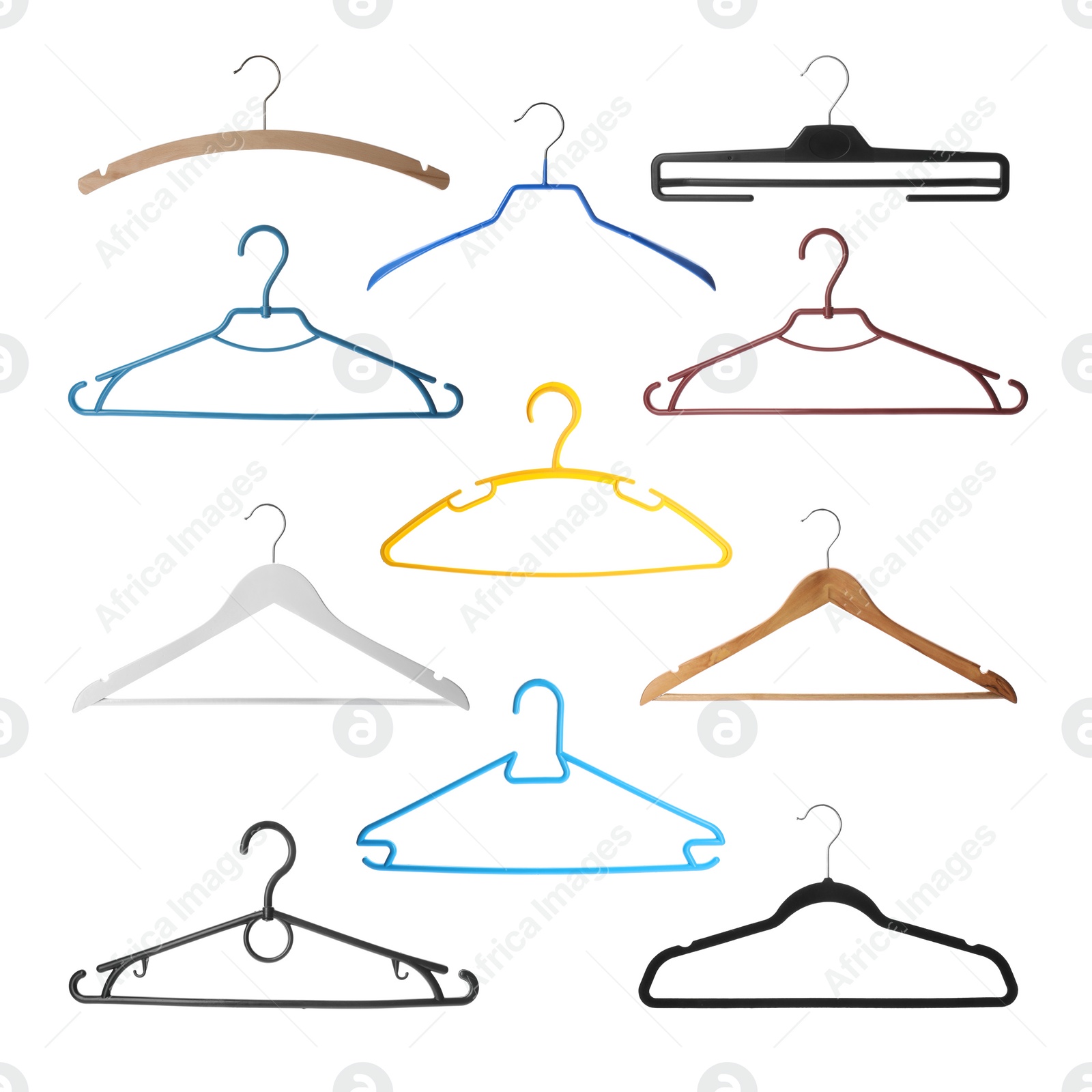 Image of Set with different empty hangers on white background