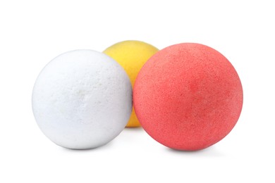 Photo of Three colorful bath bombs on white background