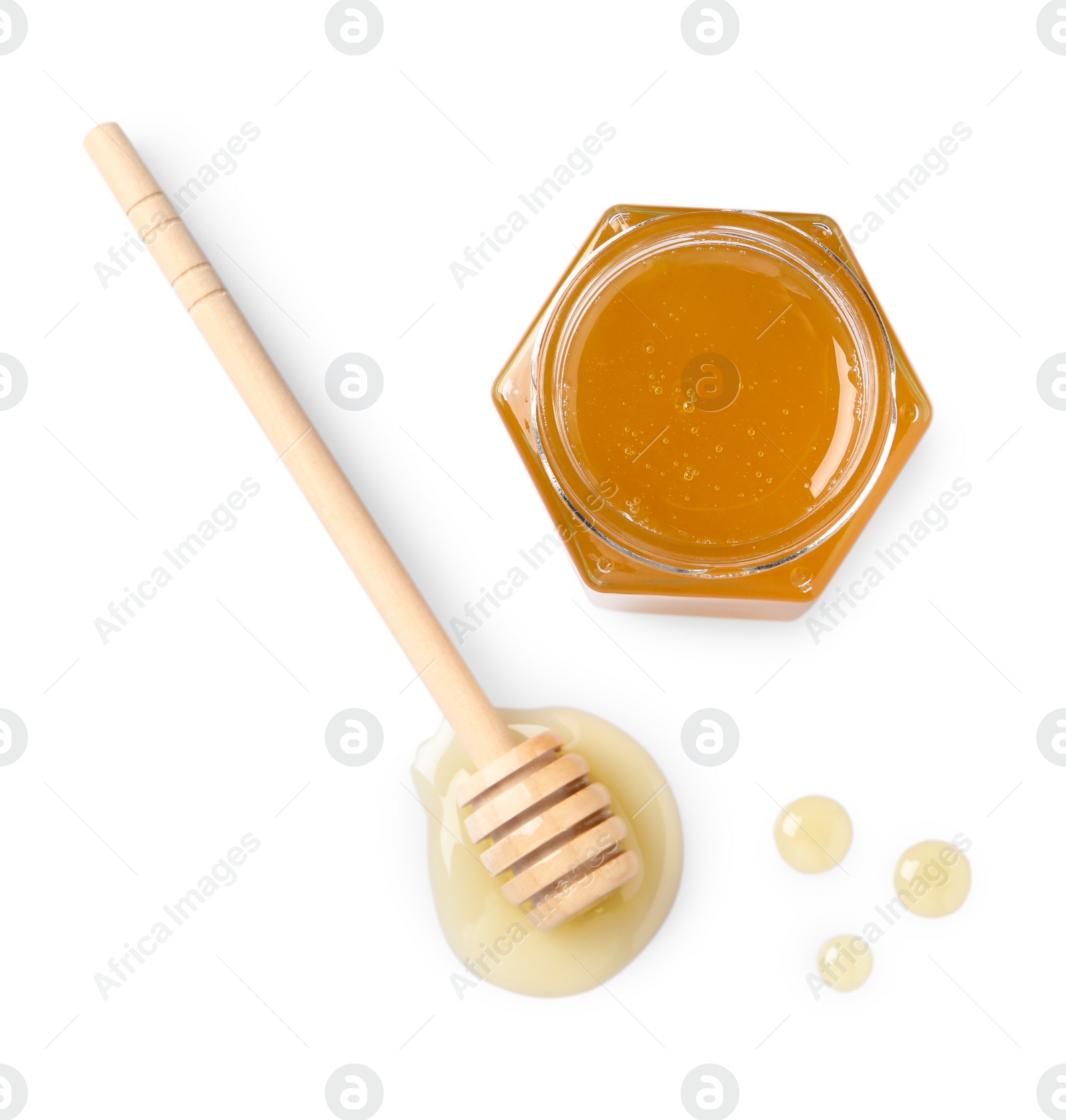 Photo of Tasty honey in glass jar and dipper isolated on white, top view