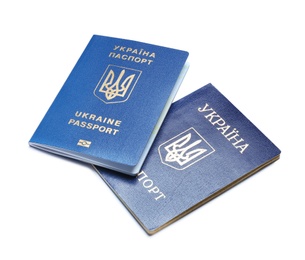 Ukrainian passports on white background. International relationships