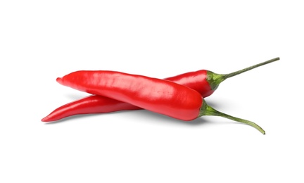 Photo of Ripe red hot chili peppers on white background