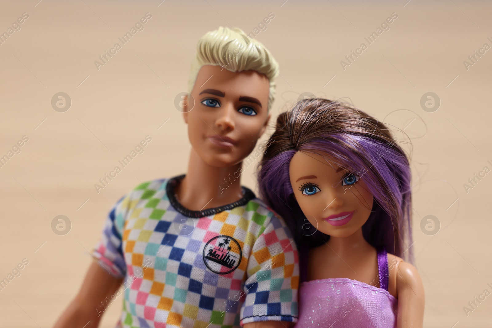 Photo of Leiden, Netherlands - September 20, 2023: Stylish Barbie and Ken dolls on beige background