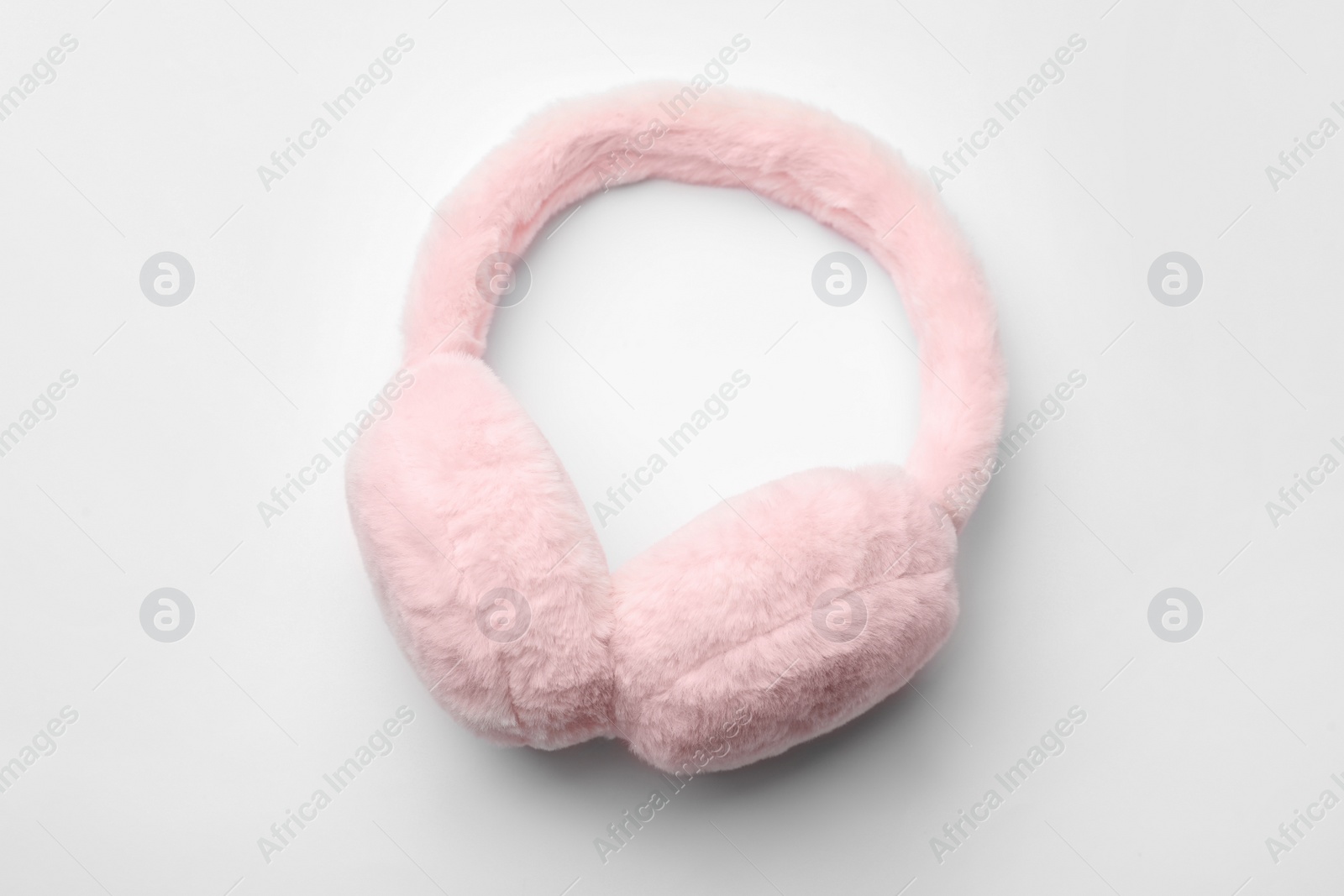 Photo of Stylish winter earmuffs on white background, top view