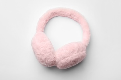 Stylish winter earmuffs on white background, top view