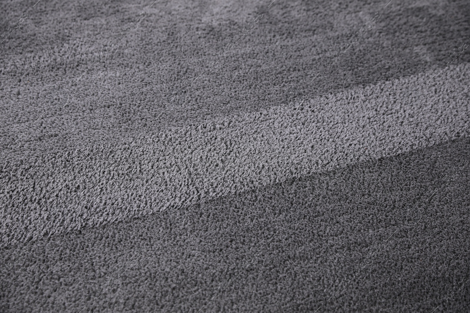 Photo of Modern grey carpet as background. Floor covering