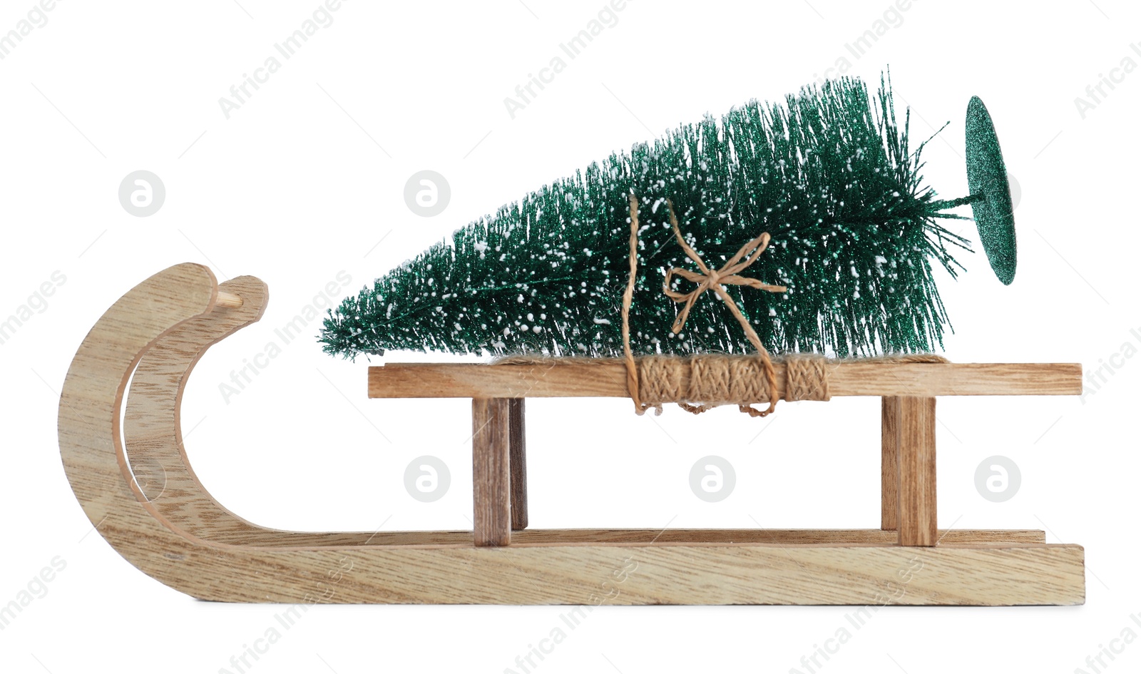 Photo of Sleigh with decorative Christmas tree isolated on white