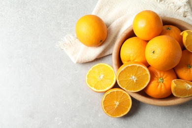 Photo of Flat lay composition with ripe oranges and space for text on light background